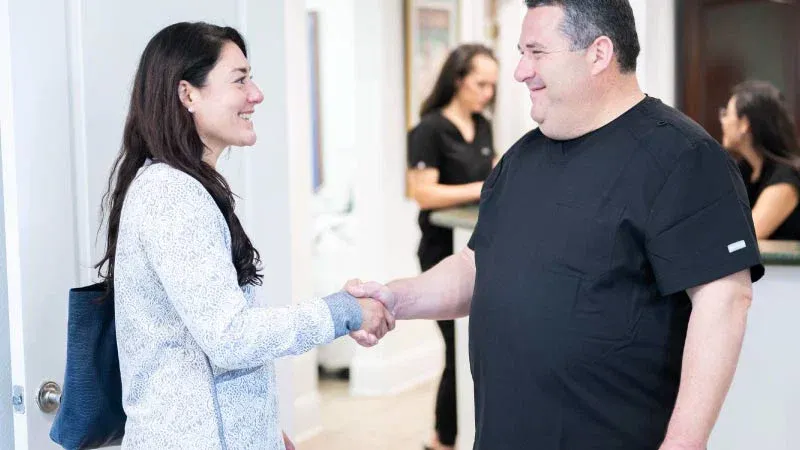 A handshake greeting at the office reception
